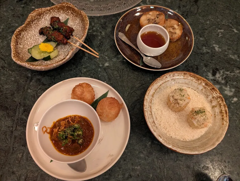 First course at Candlenut. Clockwise: pork neck satay, ngoh hiang (a kind of housemade sausage), tiger prawn curry in a little muffin kind of presentation, and beef cheek curry. Everything there was amazing, but I really loved the beef cheek curry.