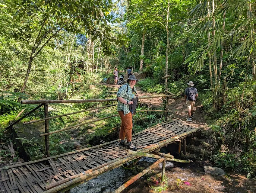 On the way to the waterfall. The bridges were made from bamboo and wobbled a little, but on the other hand, the motorcycle in the background of this shot was about to just ride across it. Sturdier than it looks.
