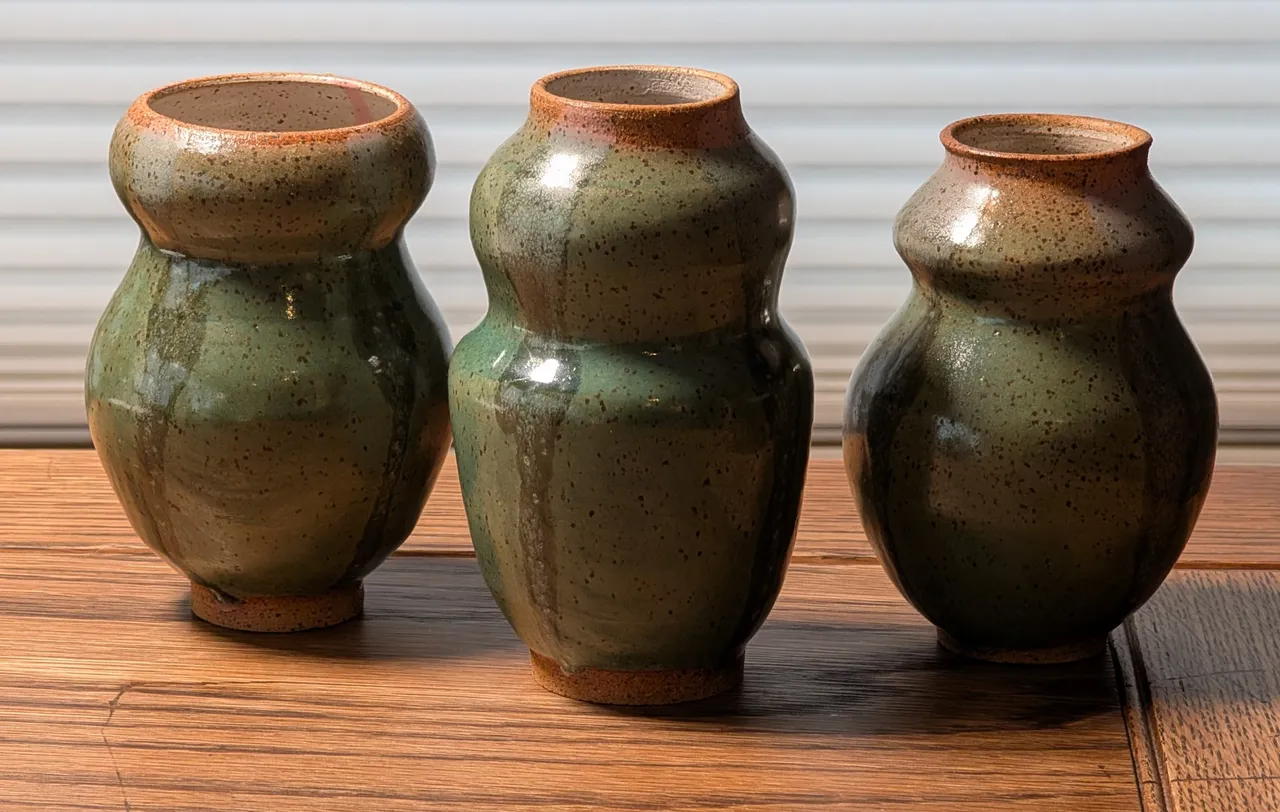 More bulbous guys. These are in the speckled clay with the green / pink glaze treatment. I also did a red clay with a crawling white glaze version, but I didn’t get any photos yet (two of them cracked in the glaze kiln because I put too much stress on the clay by shaping it and adding the crawling glaze - I may try to kintsugi them, we’ll see).