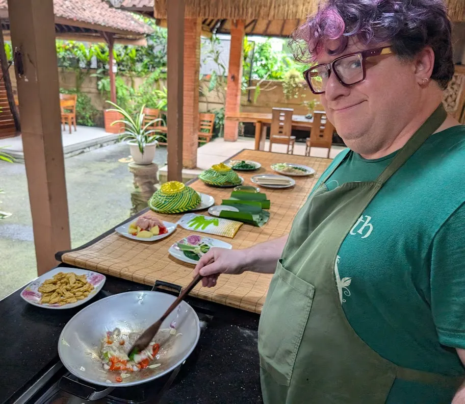 Here I’m stir-frying some veggies, in preparation for adding the fried tempeh (in the dish above the wok). Shortly after this photo was taken, I nearly dropped my phone into the wok, so we don’t have any other action shots of us cooking.