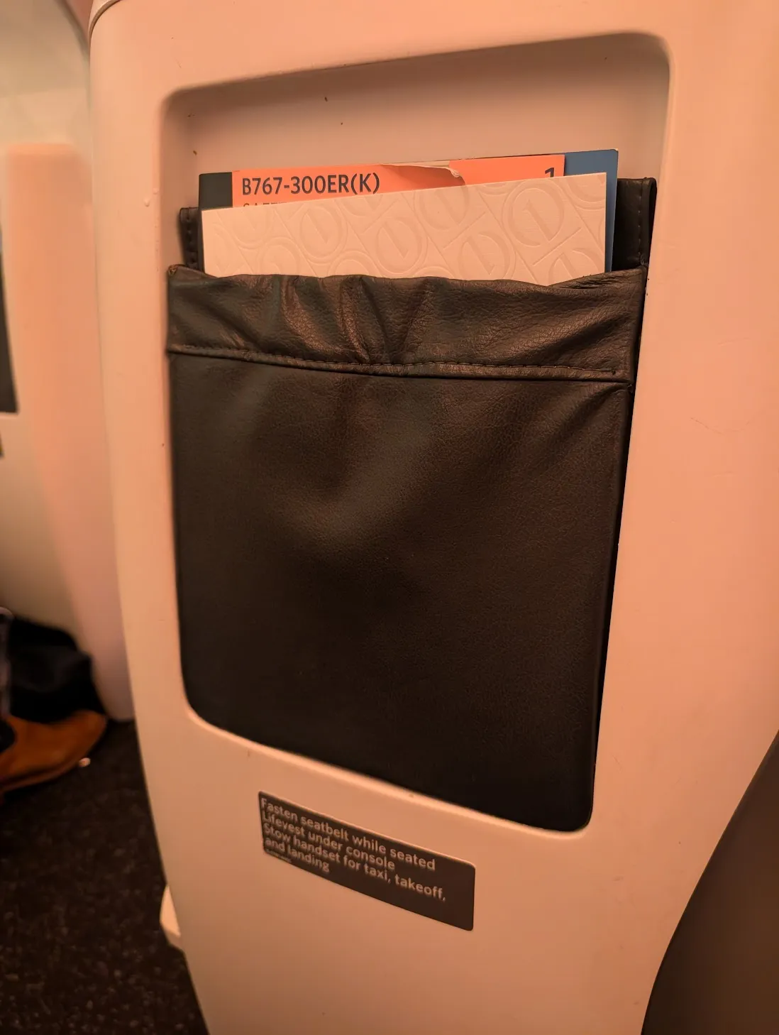 A magazine holder on the back of the seat in front of me. It is actually awful, as I will detail in the text.